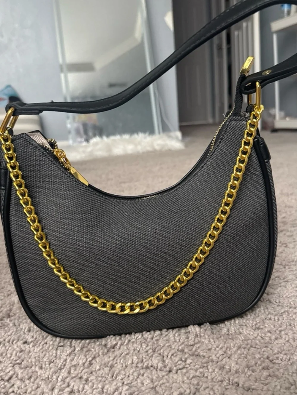 Black Crescent Shoulder Bag with Gold Chain Accent